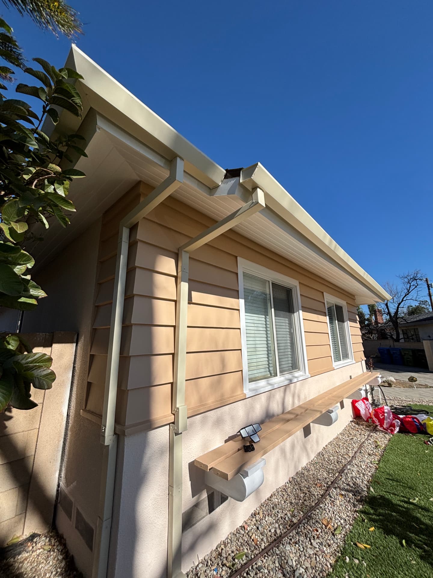 New gutters and downspouts on a ranch home